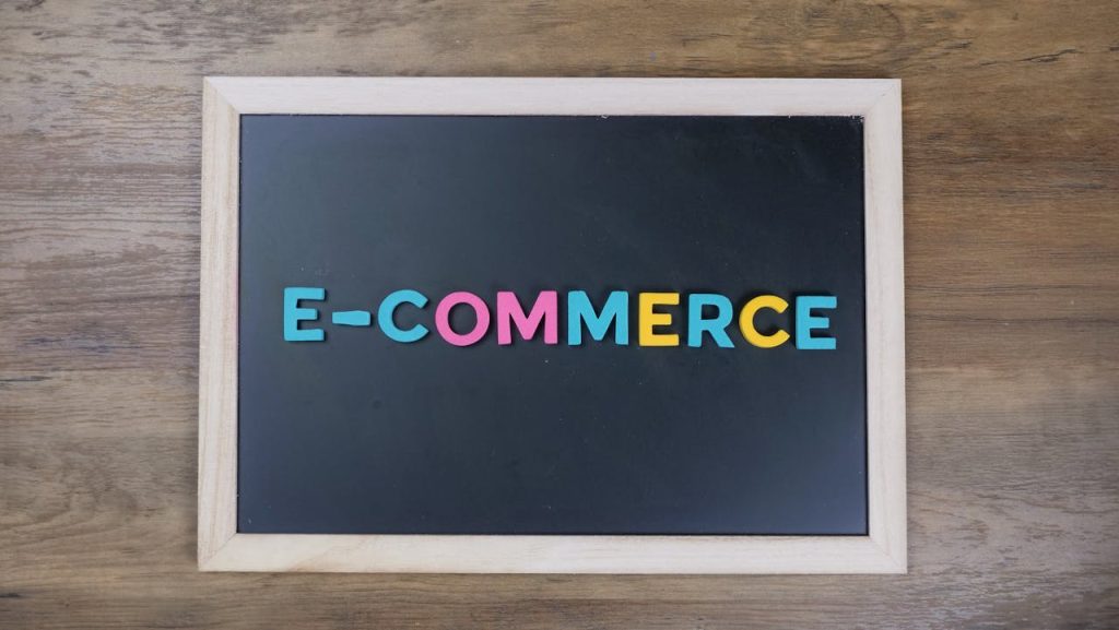 e-commerce-sign-on-black-background-board-7054753 Colorful letters spelling e-commerce on a wooden framed blackboard.